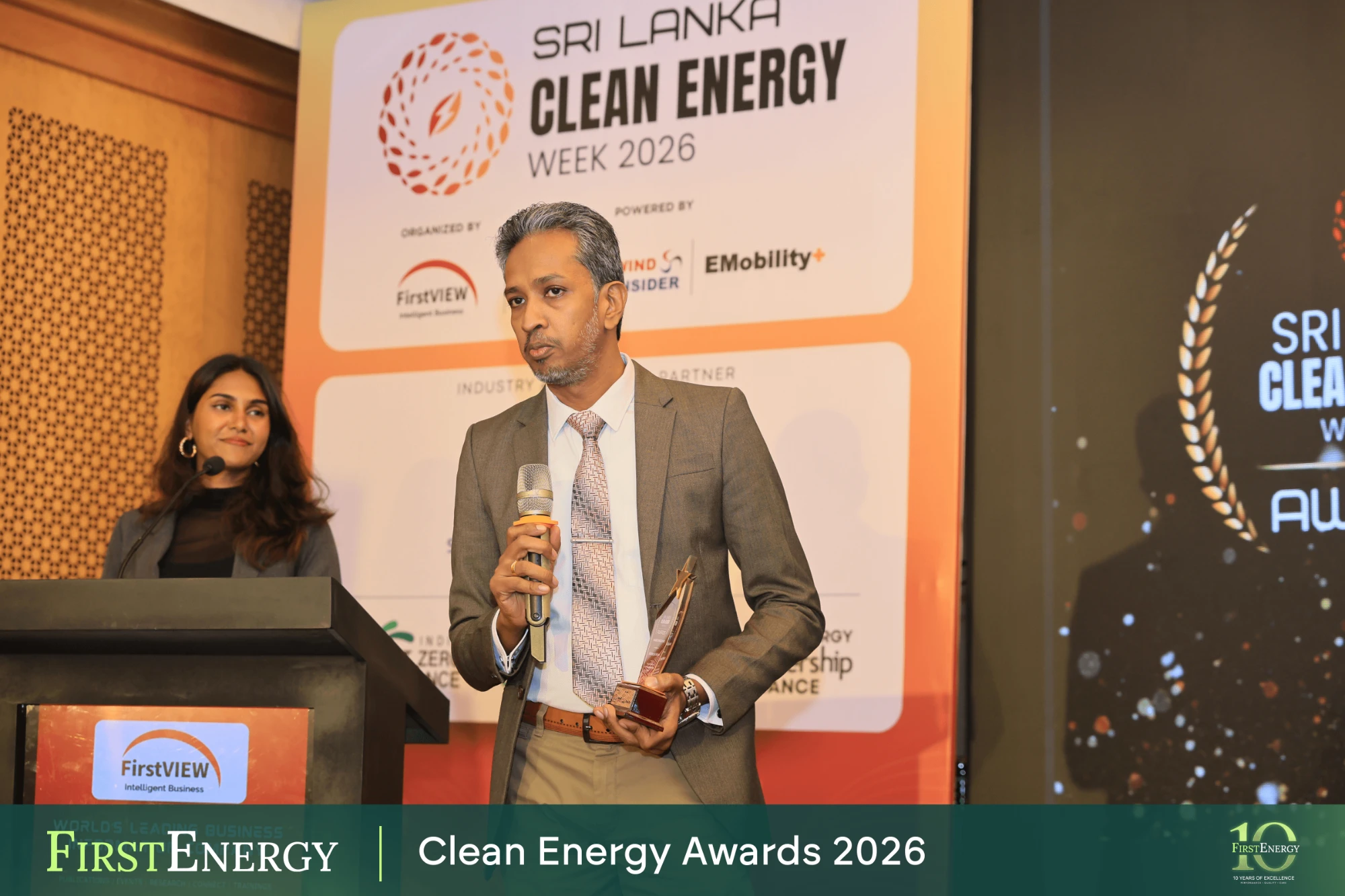 First Energy representative speaking after receiving the BIPV award at Sri Lanka Clean Energy Week 2026