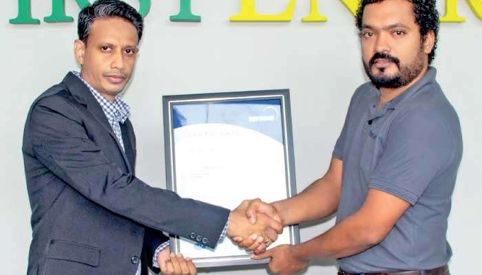 First Energy SL General Manager Sanka Liyanage receiving the ISO accreditation certificate